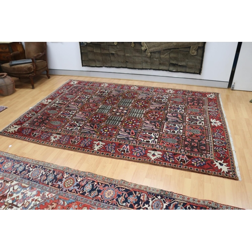 1147 - Old hand knotted carpet of red ground, approx 206cm x 310cm