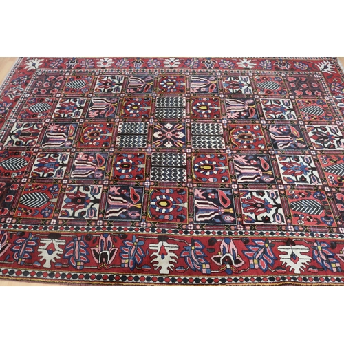 1147 - Old hand knotted carpet of red ground, approx 206cm x 310cm