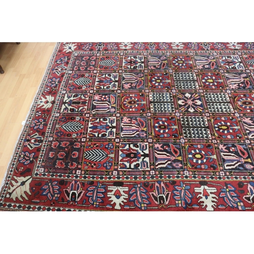 1147 - Old hand knotted carpet of red ground, approx 206cm x 310cm