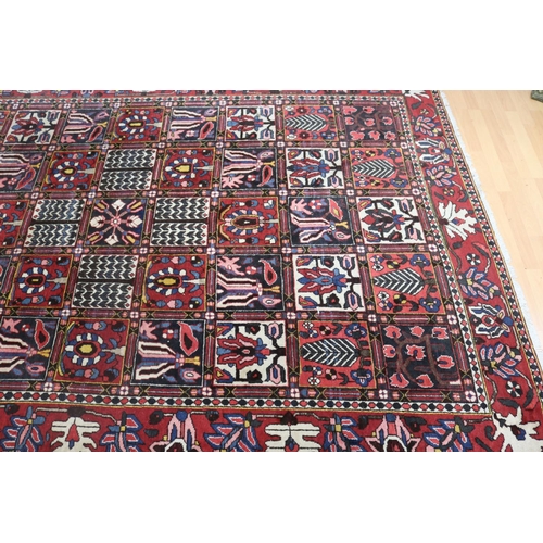 1147 - Old hand knotted carpet of red ground, approx 206cm x 310cm