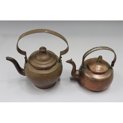 134 - Two copper teapots, approx 24cm H x 23cm W and smaller (2)