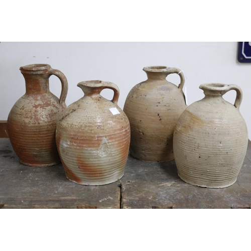 1116 - Four antique French earthenware jugs, with loop handles, approx 23cm H and shorter (4)