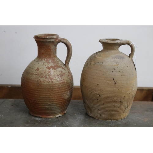 1116 - Four antique French earthenware jugs, with loop handles, approx 23cm H and shorter (4)