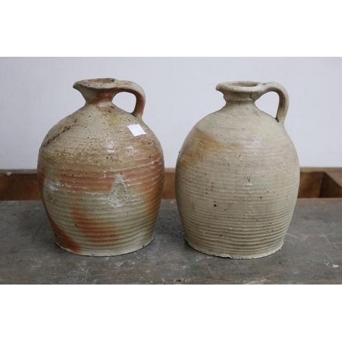 1116 - Four antique French earthenware jugs, with loop handles, approx 23cm H and shorter (4)