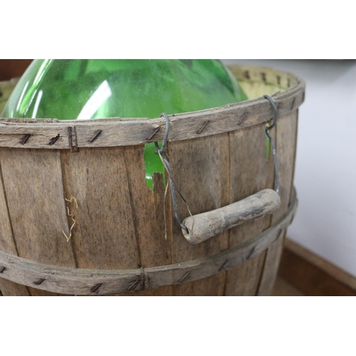 1123 - French green glass bottle bentwood cradle, approx 53cm H x 44cm Dia