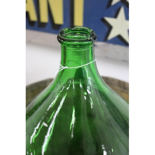 1124 - French green glass bottle in bentwood cradle, approx 53cm H x 44cm Dia