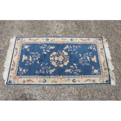 1135 - Chinese wool carpet, approx 85cm x 156cm