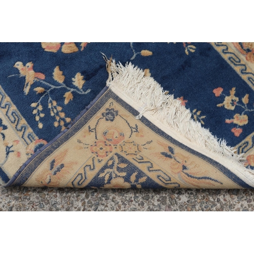 1135 - Chinese wool carpet, approx 85cm x 156cm