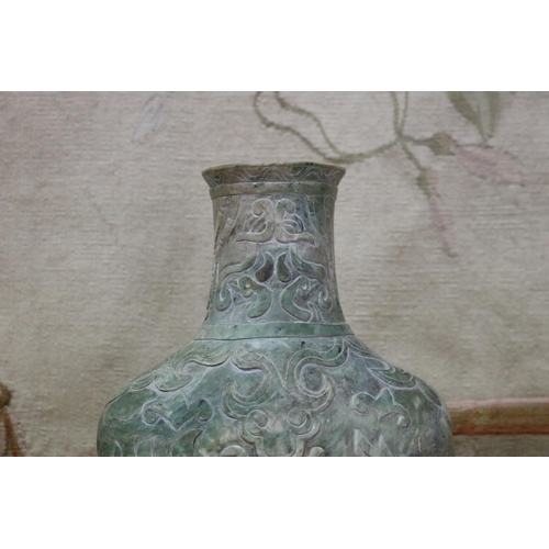 1758 - Chinese archaistic rustic green jade vase, carved in low relief, showing signs of natural cracking, ... 