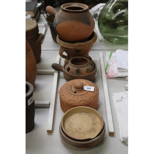 294 - Assortment of earthenware to include lids, pot, burner, etc, approx 18cm H and shorter