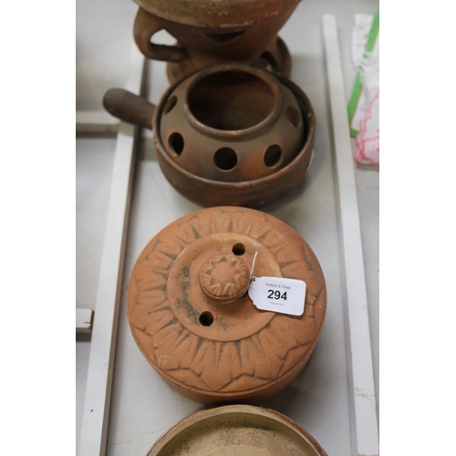 294 - Assortment of earthenware to include lids, pot, burner, etc, approx 18cm H and shorter