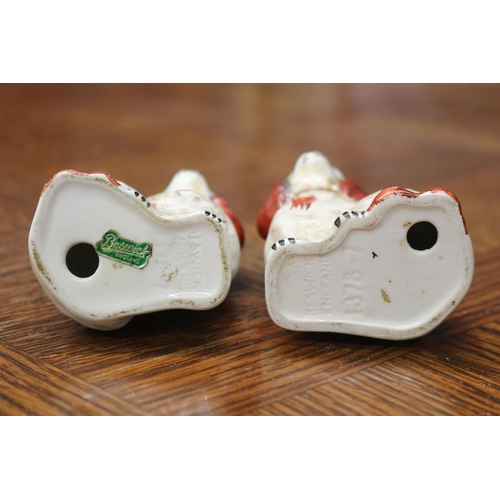 1616 - Pair of Beswick porcelain dogs, each approx 9cm H  (2)