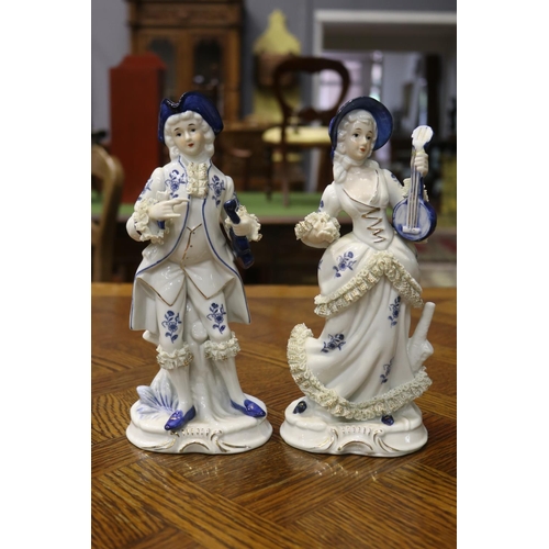 1618 - Pair of decorative porcelain male & female figures, each approx 17cm H (2)