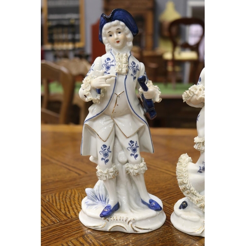 1618 - Pair of decorative porcelain male & female figures, each approx 17cm H (2)