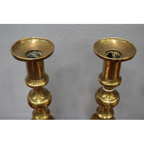 1631 - Pair of antique brass candlesticks, each approx 30cm H (2)