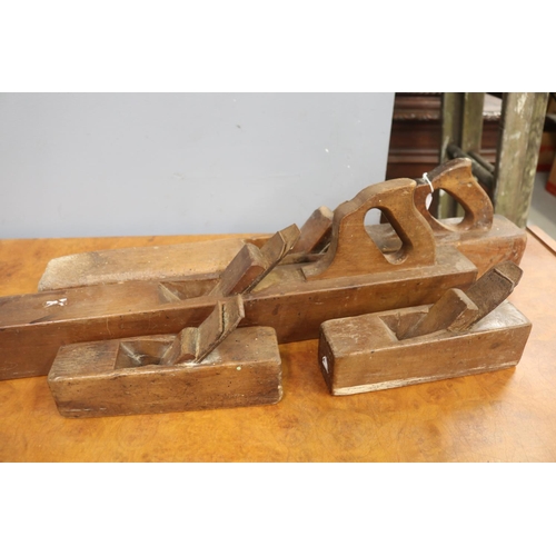 480 - Four antique and vintage wooden hand planes, approx 64cm L and shorter (4)