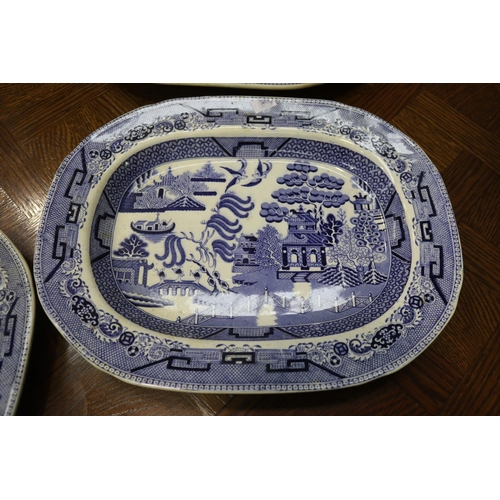 1637 - Antique Staffordshire blue and white Willow pattern platters along with a comport, approx 40cm x 32c... 