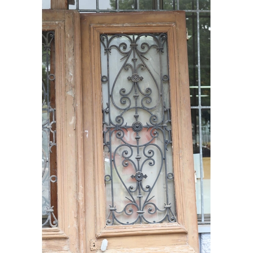 1782 - Pair of antique French entry doors, scrolling wrought iron panels to each, each approx 212cm H and a... 