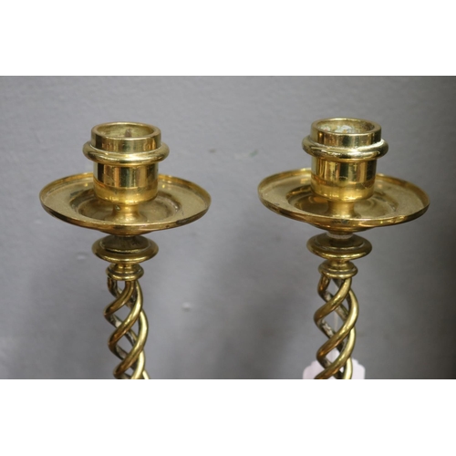 1690 - Pair of heavy brass twist candlesticks, each approx 21cm H (2)