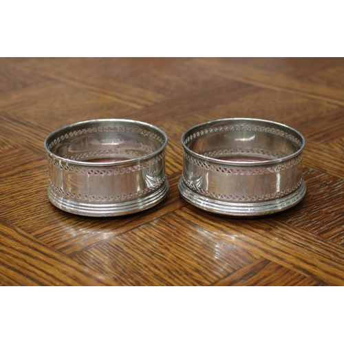 1697 - Pair of hallmarked sterling silver wine coasters, each approx 4.5cm H x 9cm Dia  (2)