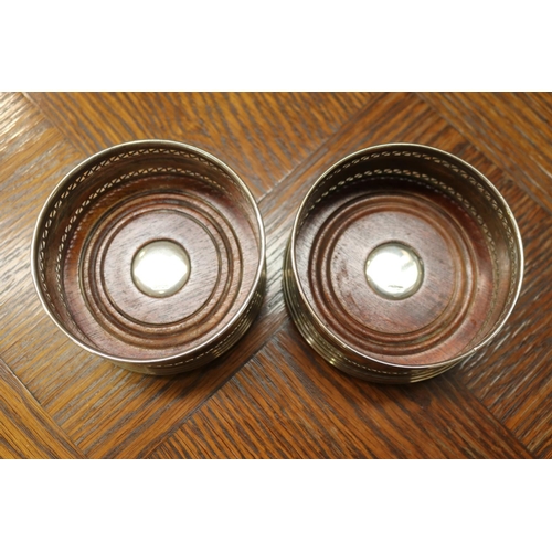 1697 - Pair of hallmarked sterling silver wine coasters, each approx 4.5cm H x 9cm Dia  (2)