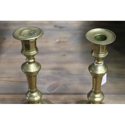 1699 - Pair of antique brass candlesticks, each approx 25cm H (2)