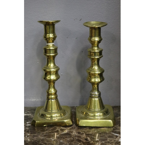 1702 - Pair of antique brass candlesticks, each approx 22cm H  (2)