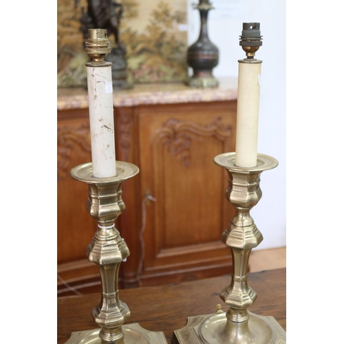 1028 - Pair of large English brass period style candlestick form lamps, with wooden bases, unknown working ... 