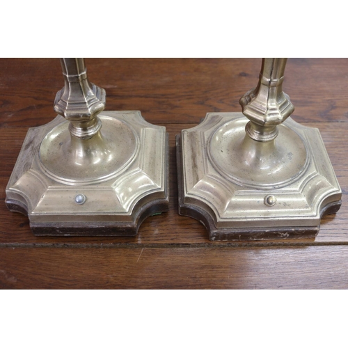 1028 - Pair of large English brass period style candlestick form lamps, with wooden bases, unknown working ... 