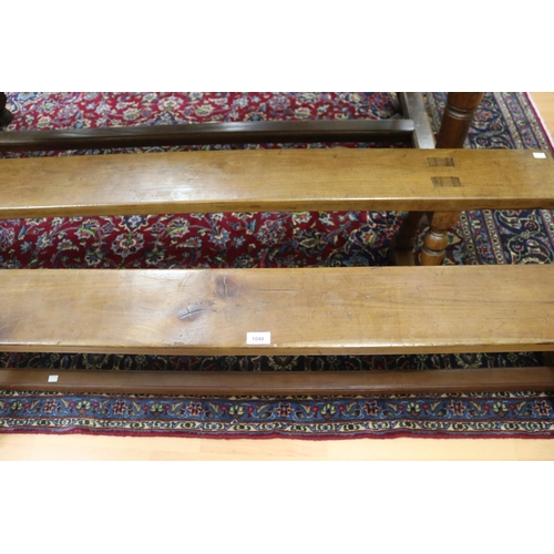 1048 - Pair of French long benches, turned trestle ends with central stretcher, each approx 47cm H x 198cm ... 
