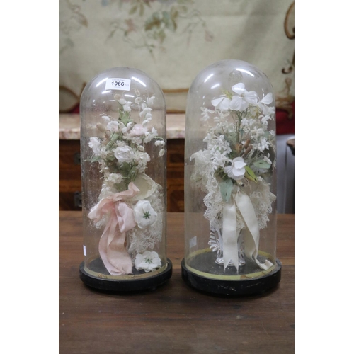 1066 - Pair of antique French glass marriage domes, each with porcelain vase and floral arrangement's,  eac... 