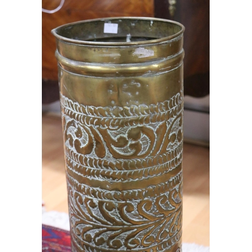 1080 - Repousse brass cylinder umbrella stand, approx 64cm H