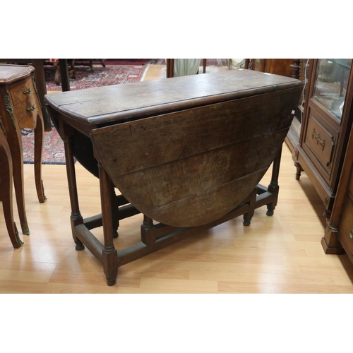 1144 - Antique English 18th century oak gateleg table, approx 73cm H x 115cm W x 148cm D (sides up)