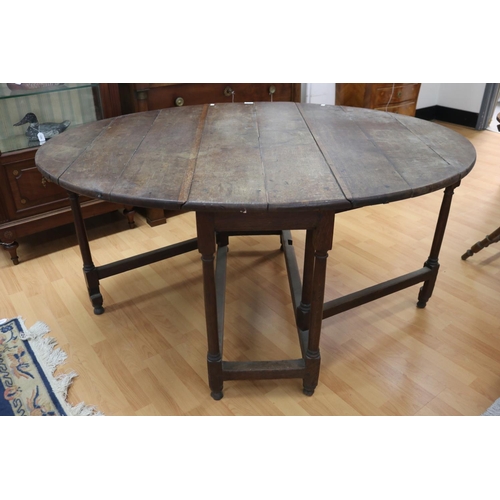 1144 - Antique English 18th century oak gateleg table, approx 73cm H x 115cm W x 148cm D (sides up)