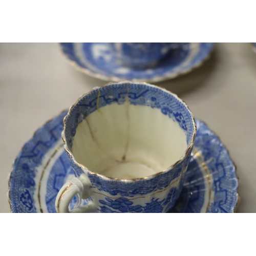 155 - Four antique blue and white Willow pattern teacups and saucers