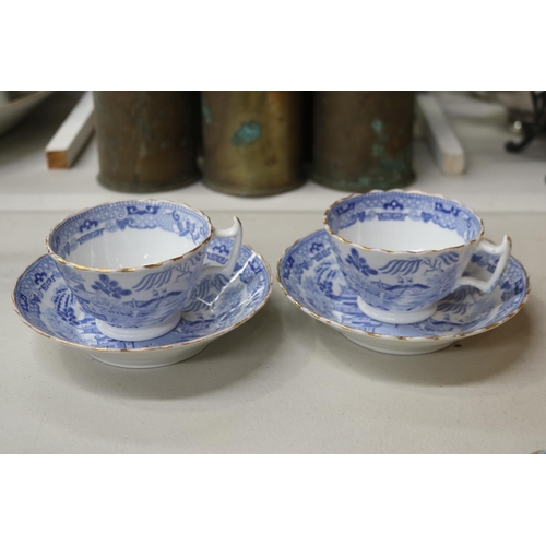 155 - Four antique blue and white Willow pattern teacups and saucers