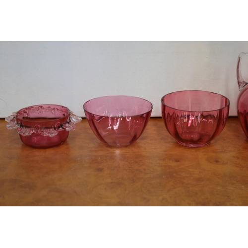 225 - Three ruby glass jugs and three bowls, approx 21cm H and shorter (6)