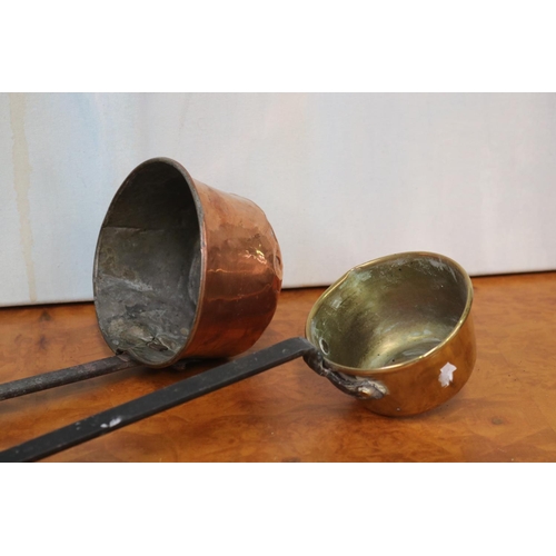 253 - French copper scoop along with a brass scoop, approx 41cm L and shorter (2)