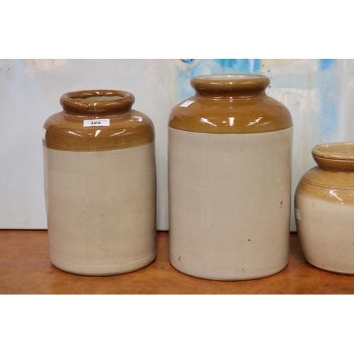 320 - Four antique  earthenware bung jars, approx 31cm H and shorter (4)