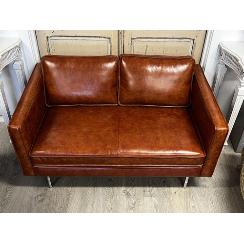 194 - New unused vintage style as new brown faux  leather two seater sofa with leather footstool to match,... 