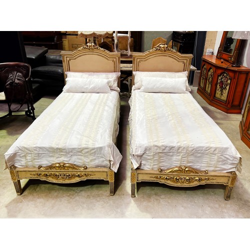 184 - Fine pair of antique French painted and gilt highlight single beds, standing on stop fluted tapering... 