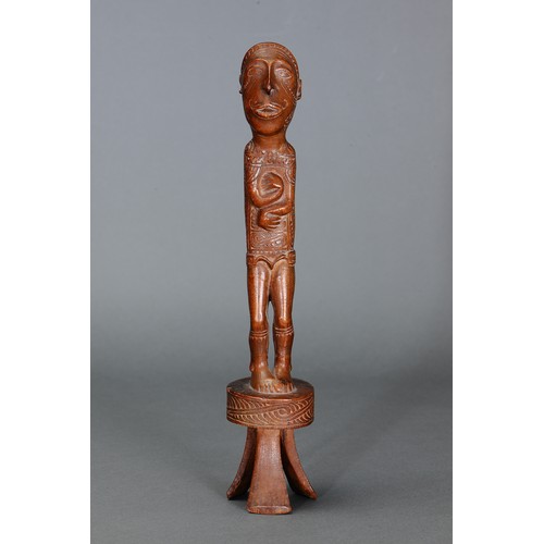 54 - Fine Massim Standing Figure by Mutuaga, Trobriand. Islands, Papua New Guinea. Carved and engraved ha... 