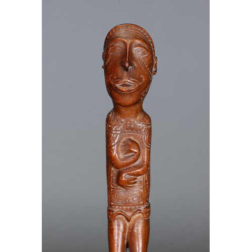 54 - Fine Massim Standing Figure by Mutuaga, Trobriand. Islands, Papua New Guinea. Carved and engraved ha... 