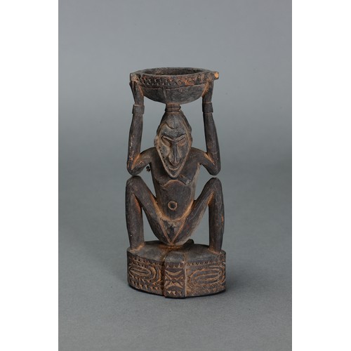59 - Sepik Betlenut Mortar, Papua New Guinea. Carved and engraved hardwood. Later 20thC betlenut mortar w... 
