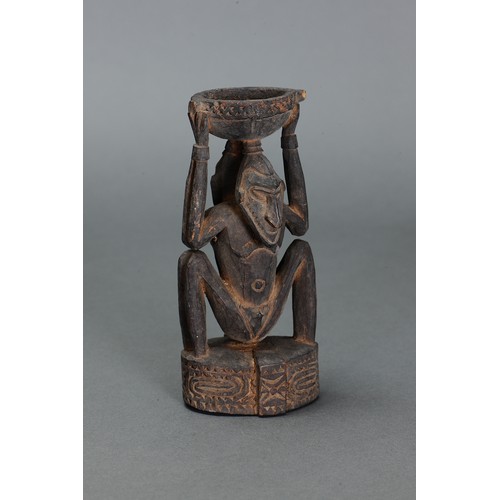 59 - Sepik Betlenut Mortar, Papua New Guinea. Carved and engraved hardwood. Later 20thC betlenut mortar w... 