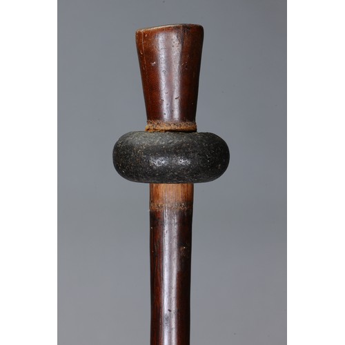68 - New Britain Stone Headed Club, Papua New Guinea. Carved hardwood and stone. Club with stone head and... 