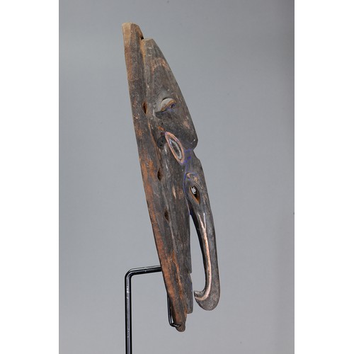 86 - Early Sepik Mask, Papua New Guinea. Carved and engraved hardwood and natural pigment. Approx L58.5 x... 