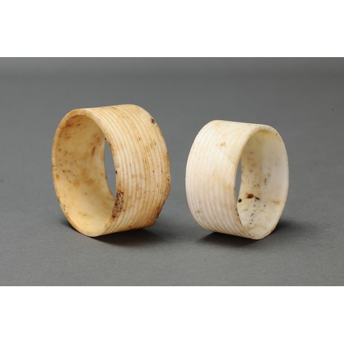 131 - Pair of Fine Reeded Nissan Arm Bands, Tanga Island, New Ireland. Carved and engraved tridacna clam s... 