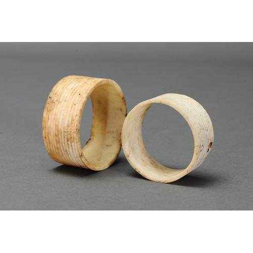 131 - Pair of Fine Reeded Nissan Arm Bands, Tanga Island, New Ireland. Carved and engraved tridacna clam s... 