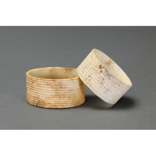 131 - Pair of Fine Reeded Nissan Arm Bands, Tanga Island, New Ireland. Carved and engraved tridacna clam s... 